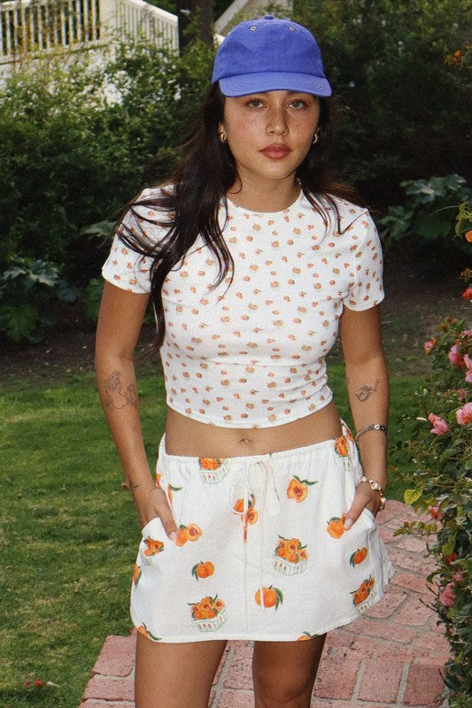 “teaches of peaches” baby tee