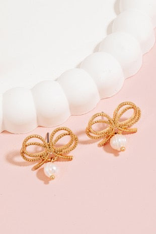 Accesorios 
“bow and pearl” earrings